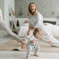 A joyful family engaging in morning stretches together, fostering a fun and healthy routine.